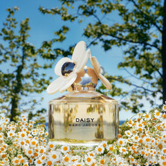 Marc Jacobs Daisy small bottle next to lipstick for scale and convenience