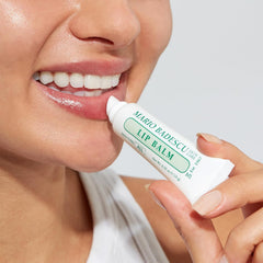 Mario Badescu tube in hand to show size and travel-friendly convenience