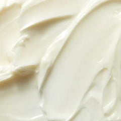 Applying Mario Badescu neck cream with upward strokes to décolletage for firmer appearance