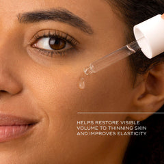 Medik8 Liquid Peptides in hand to show one‑ounce scale and travel‑friendly size