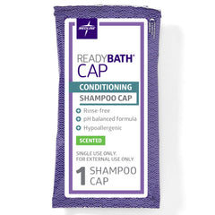 Medline ReadyBath cap next to hand for size comparison illustrating convenience