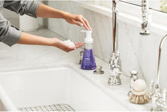 Method soap being pumped at kitchen sink for fast, convenient handwashing