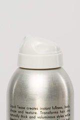 Michael Christopher applying spray at roots for noticeable volume benefit