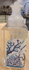 Michel Design Works bottle beside towel showing size and stylish sink display benefit