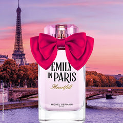 Michel Germain fragrance spray in hand demonstrating travel-friendly size benefit: easy on-the-go touch-ups