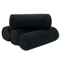 MICROFI front packaging view showing four black towels and quick-dry benefit