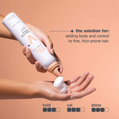milk_shake mousse foam texture in hand illustrating lightweight, airy hold