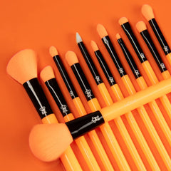 MODA model applying foundation with neon orange brush for even, streak-free coverage