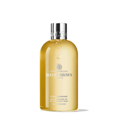 Molton Brown front bottle shot showing label and elegant packaging benefit: clear product identity