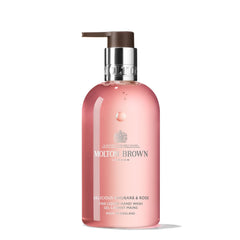 Molton Brown bottle front view showing rhubarb and rose scent and elegant label