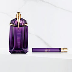 Mugler Alien bottle in hand demonstrating compact 0.3 fl oz convenience