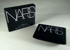 NARS ORGASM size comparison next to lipstick showing compact scale for travel