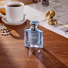 Nautica Voyage bottle beside watch showing 3.3 oz scale and travel-ready size