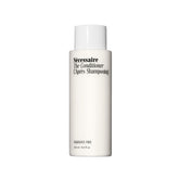 Nécessaire frontal bottle showing minimalist packaging and easy dispensing benefit
