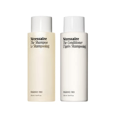 Nécessaire front packaging showing the fragrance-free hair duo benefits