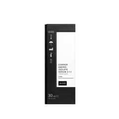 NIOD serum on bathroom shelf next to towels illustrating daily routine simplicity