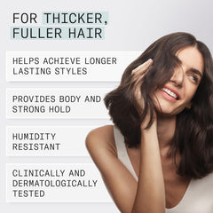 NIOXIN can in hand showing size and portability for on-the-go styling