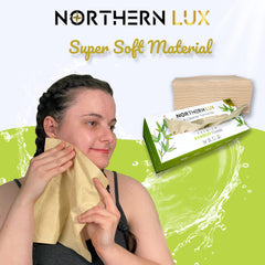 Northern Lux towel held wet to show strength and no-tear durability during use