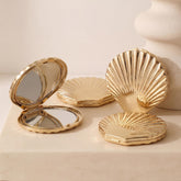 Novabright front view of golden seashell compact mirror showing elegant finish and portability benefits