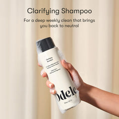 Odele clarifying shampoo pump and cap detail illustrating easy dispensing