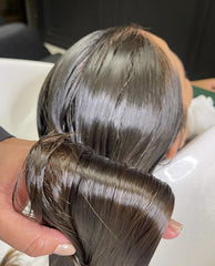 Applying OGC Cosmetics treatment to hair strand for targeted repair and smoothing