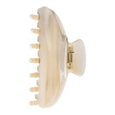 OideGuiing front view showing creme claw clip, durable hold benefit