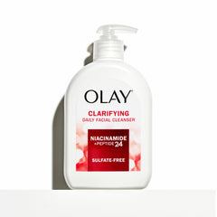 Olay cleanser in hand lathering on face, demonstrating gentle effective cleansing