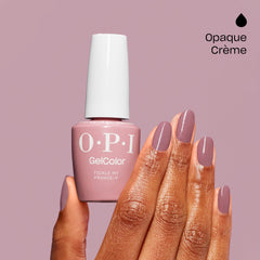 Hands wearing OPI Tickle My France-y for a natural, long-lasting look
