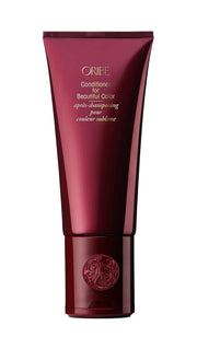 Oribe conditioner front packaging showing bottle and label, brand protects color