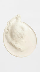 ORIBE bottle in shower scene illustrating hydration and aromatic experience benefit