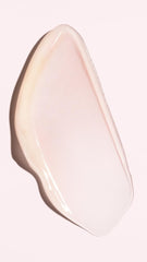 Oribe leave-on treatment being dispensed into hand demonstrating easy application and quick feel
