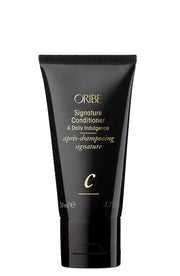 Oribe signature conditioner front packaging shows elegant bottle and brand for luxury results