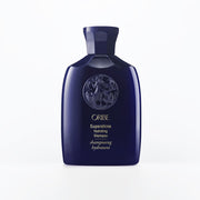 Oribe bottle front view showing branding and glossy design, promotes luxurious hydration
