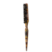 ORIBE teasing brush front view showing polished resin and mixed bristles for precise styling