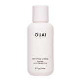 OUAI travel anti frizz cream front packaging showing compact tube and branding for convenience