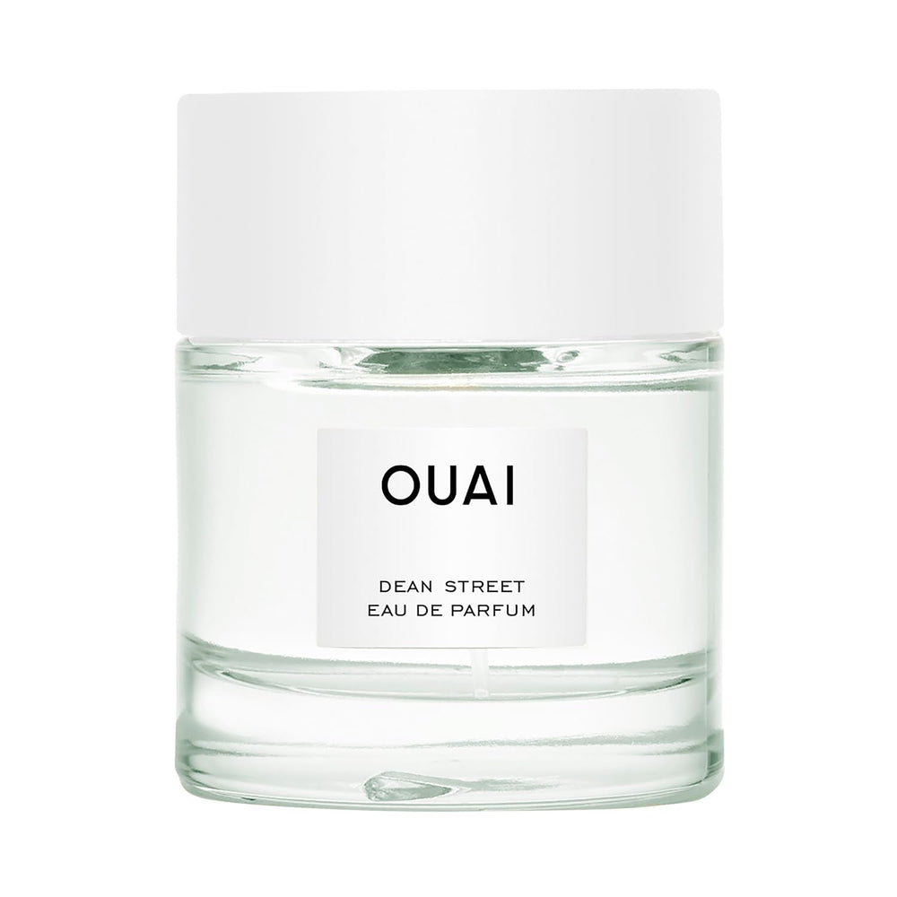 OUAI bottle front view showing elegant glass and label for everyday wear
