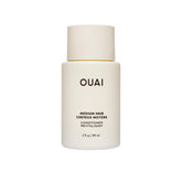 OUAI front bottle showing travel-size packaging and portability benefit