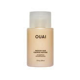 OUAI front bottle view showing clean packaging and travel-friendly size benefit