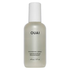 OUAI bottle front view showing volume-boosting spray benefits