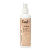 Ouidad Curl Shaper front packaging showing bottle and label benefits
