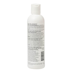 Ouidad shampoo texture close-up showing creamy consistency and moisturizing benefit