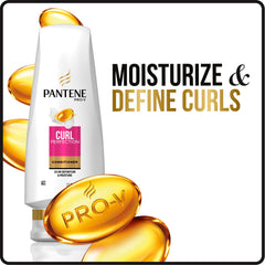 Applying Pantene conditioner to wet curls for smoother detangling