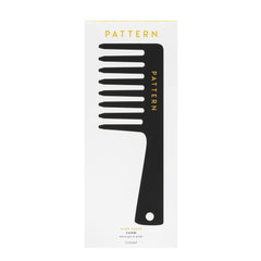 PATTERN comb held in hand to show scale and comfortable control
