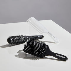 Paul Mitchell brush in use during blow-dry creating volume and faster results