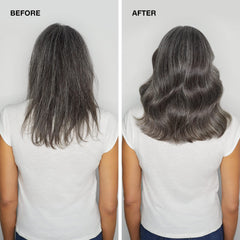 Paul Mitchell bottle in hand to show 16.9 fl oz size and scale