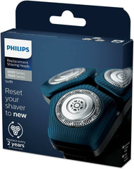 PHILIPS sh71/50 three-head pack next to ruler showing size and included pieces