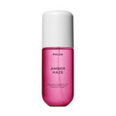 PHLUR Amber Haze front bottle showcasing warm amber packaging and elegant design