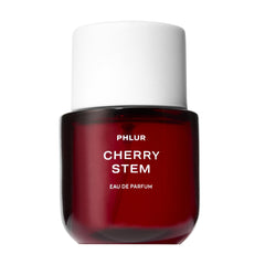 PHLUR front bottle view showing sleek glass and label, highlights premium design