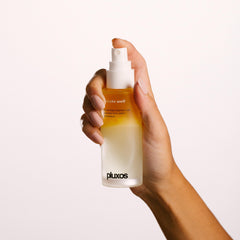 PLUXOS 47 close-up mist spray demonstrating fine, even coverage benefit