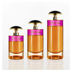 Woman spritzing Prada Candy showing application and quick scent refresh benefit